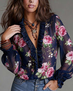 Blusa con volante en el dobladillo, media cremallera y estampado floral