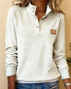 Polo-neck sweater with partially open placket