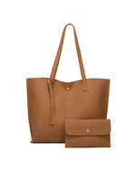 Bolso bandolera de color liso con borlas y gran capacidad