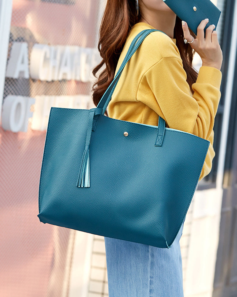 Bolso bandolera de color liso con borlas y gran capacidad