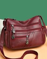 Bolso bandolera de cuero suave con múltiples bolsillos