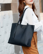 Solid-colored crossbody bag with tassels and large capacity