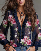 Blouse with a ruffled hem, half-zip, and floral print