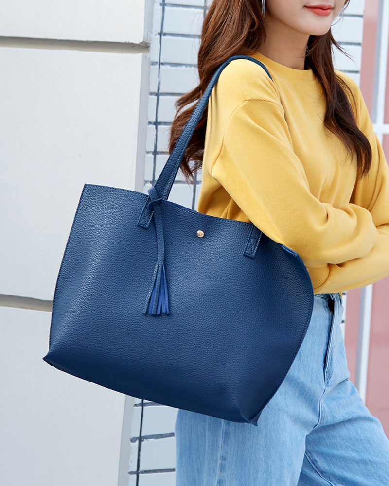 Solid-colored crossbody bag with tassels and large capacity