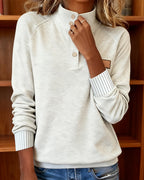Polo-neck sweater with partially open placket