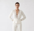 V-neck blouse with lace trim.