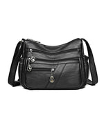 Bolso bandolera de cuero suave con múltiples bolsillos