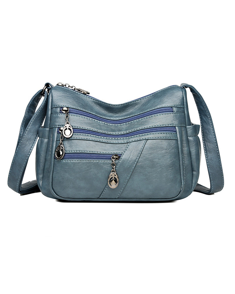 Bolso bandolera de cuero suave con múltiples bolsillos