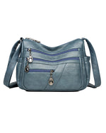 Bolso bandolera de cuero suave con múltiples bolsillos