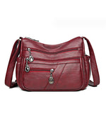 Bolso bandolera de cuero suave con múltiples bolsillos