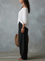 Alba | Conjunto blanco con hombros descubiertos y pantalones tipo farol
