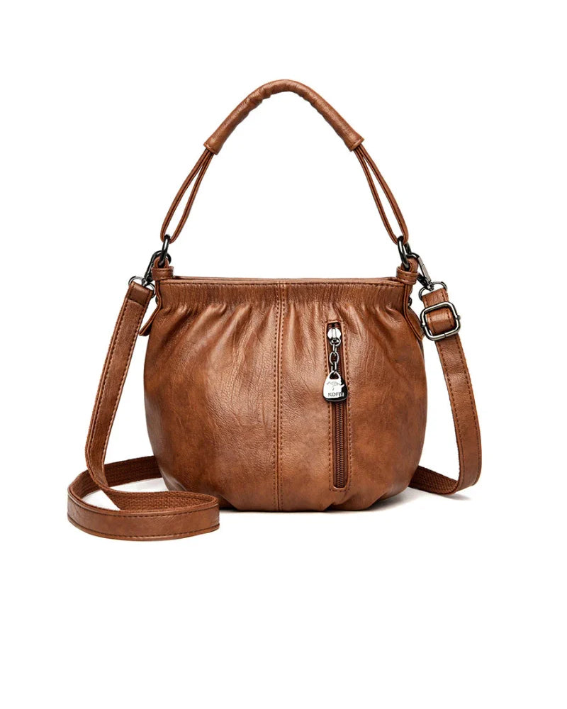 Bolso de mano casual plisado tipo cubo de cuero suave